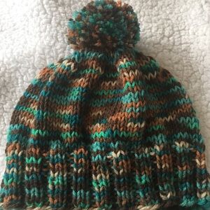 Handknit hat wit pompom